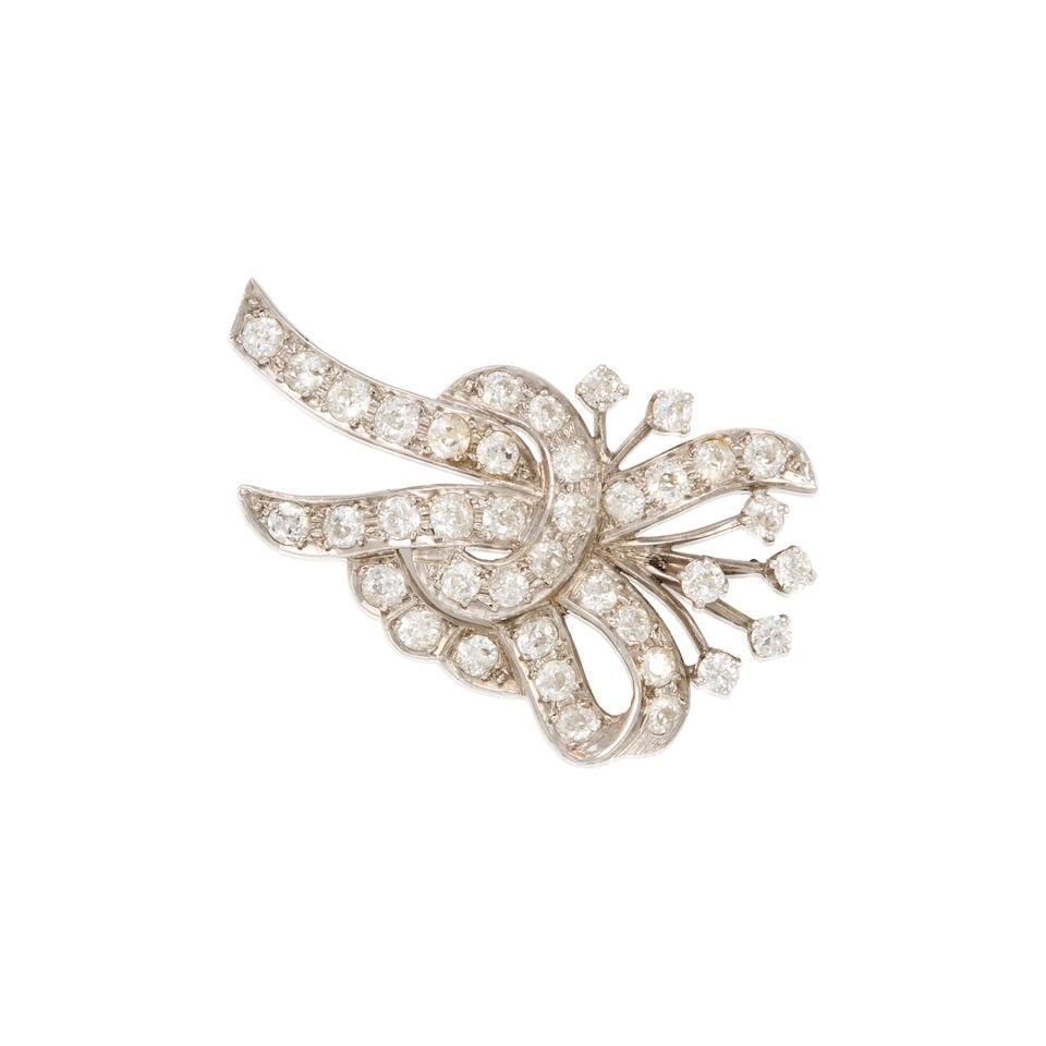 PLATINUM AND DIAMOND BROOCH: PLATINUM AND DIAMOND BROOCH • Platinum • Numerous old European cut diamonds weighing approximately 3.90 carats total • May be worn as a pendant • Measures 2 in x 1 1/4