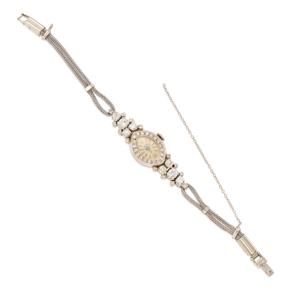 14K GOLD AND DIAMOND WRISTWATCH: 14K GOLD AND DIAMOND WRISTWATCH • 14K white gold watch case and bracelet • Numerous round shaped diamonds weighing approximately 1.80 carats total • Signed ELGIN on the dial •