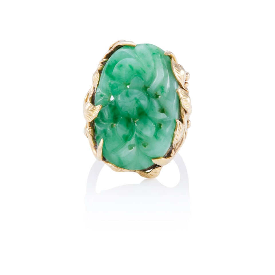 14K GOLD AND JADE RING: 14K GOLD AND JADE RING • 14K yellow gold • One carved jade measuring approximately 25.25mm x 16.96mm x 7.67mm • Size 7 1/2 • Estimated gross weight: 15.5 grams Footnotes: This 