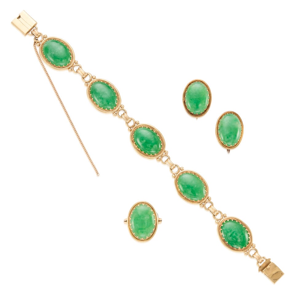 MINGS: 14K YELLOW GOLD AND JADE SUITE WITH GIA REPORT: MINGS: 14K YELLOW GOLD AND JADE SUITE WITH GIA REPORT • One 14K yellow gold ring with an oval cabochon jade measuring approximately 16.91mm x 12.52mm x 2.99mm, size 5 1/4 • One pair of