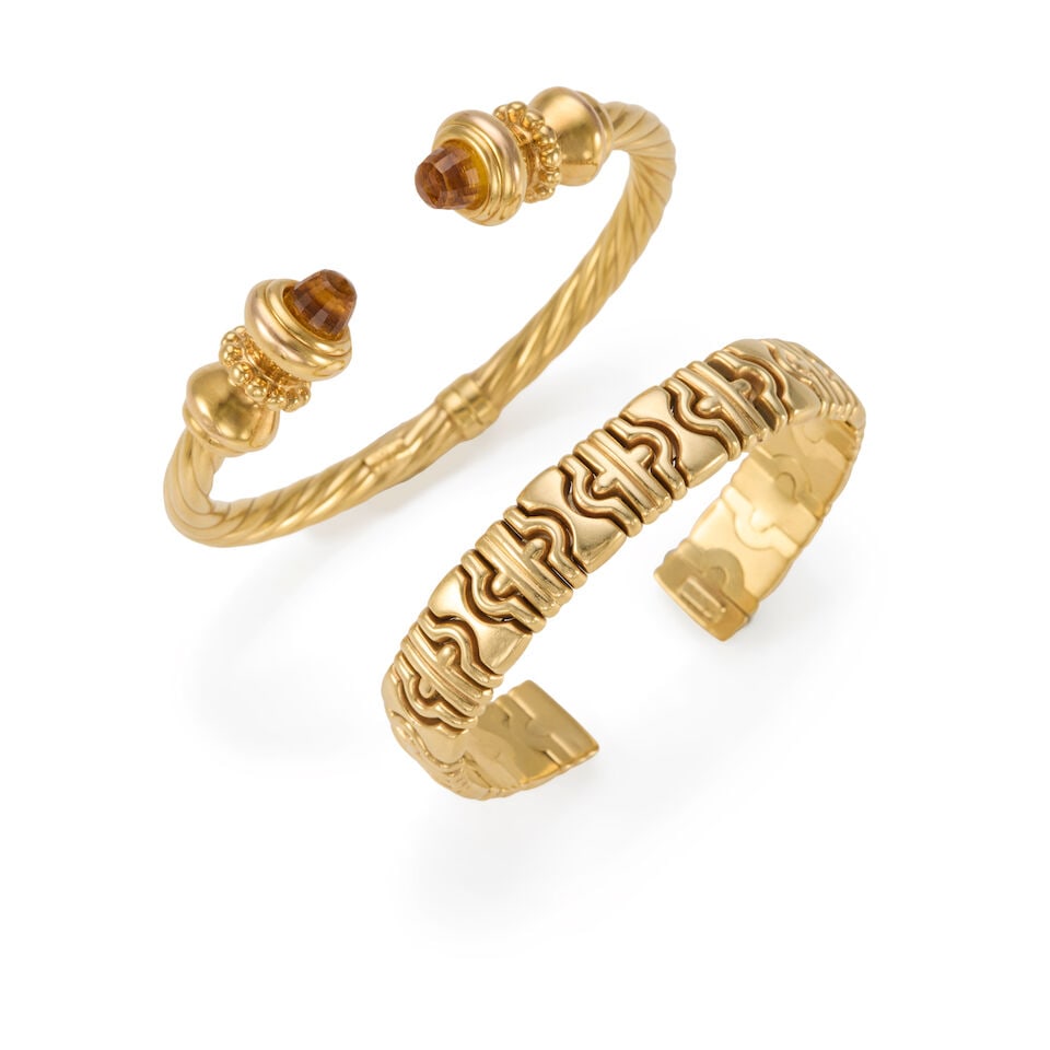 TWO 14K GOLD CUFF BRACELETS: TWO 14K GOLD CUFF BRACELETS • One hinged cuff bracelet of 14k yellow gold with 2 citrine accents, inner circumference 6 1/4 in., gap measures 5/8 in. • One cuff bracelet of 14k yellow gold