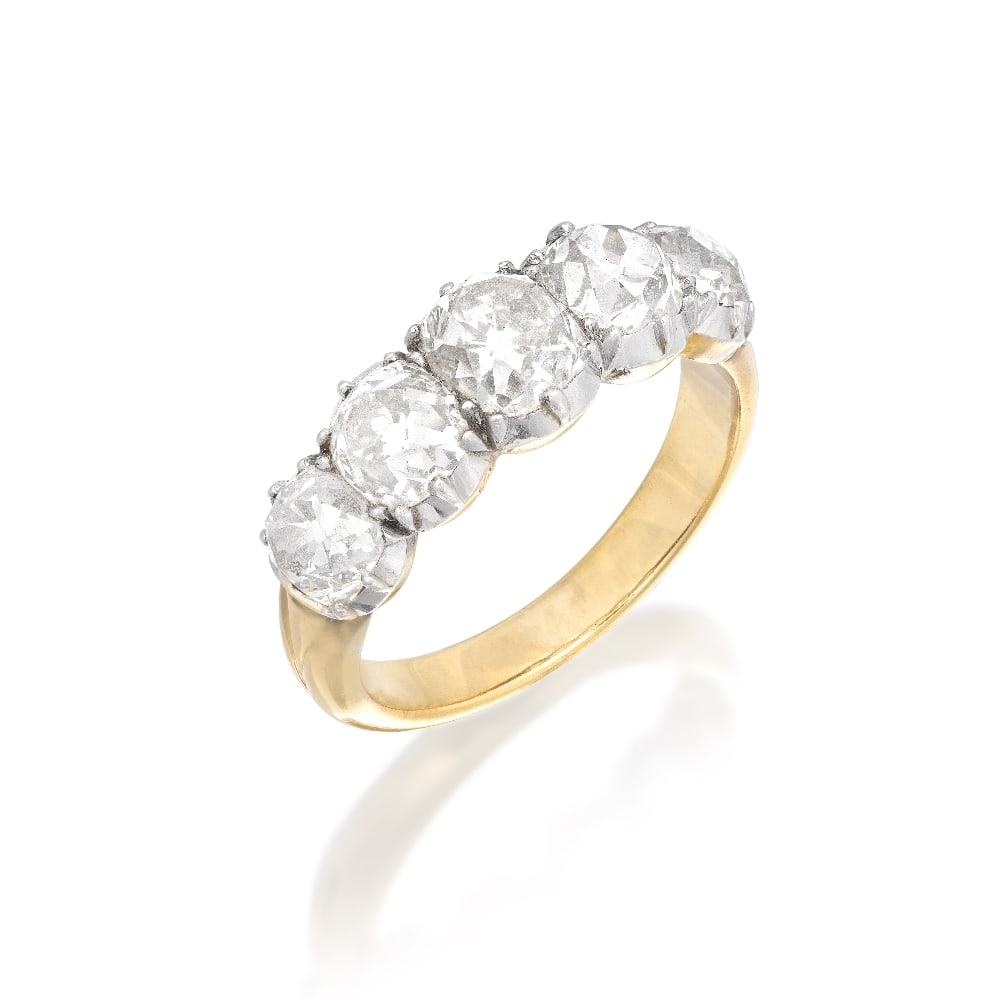 DIAMOND FIVE-STONE RING, CIRCA 1880: DIAMOND FIVE-STONE RING, CIRCA 1880 Set to the front with graduating old brilliant-cut diamonds, in pinched collet settings, between fluted shoulders, mounted in silver and gold, diamonds approximatel