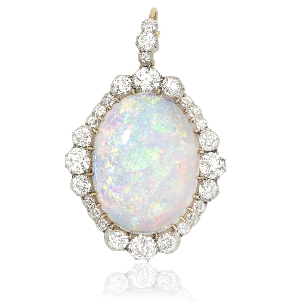 OPAL AND DIAMOND PENDANT, CIRCA 1900: OPAL AND DIAMOND PENDANT, CIRCA 1900 The opal cabochon within a surround of old brilliant-cut diamonds, graduating in size at each cardinal point, the detachable surmount similarly-set, mounted in