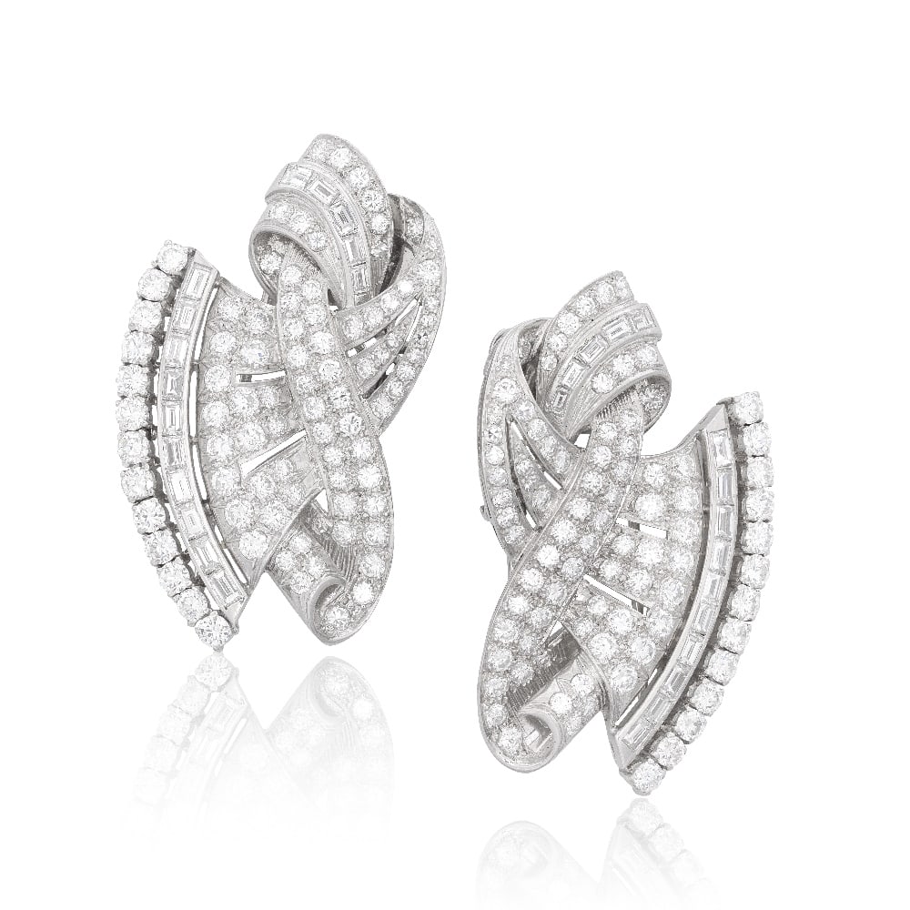 DIAMOND DOUBLE-CLIP BROOCH, CIRCA 1950: DIAMOND DOUBLE-CLIP BROOCH, CIRCA 1950 Of scrolling design, set with brilliant, single and baguette-cut diamonds, diamonds approximately 10.60 carats total, length 5.5cm Footnotes: A Private Family Le