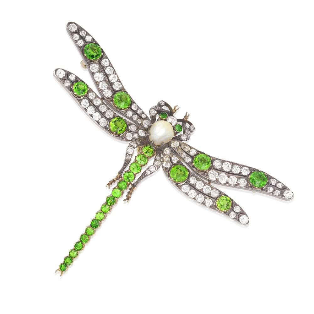 DEMANTOID GARNET, PEARL AND DIAMOND DRAGONFLY BROOCH, CIRCA 1890: DEMANTOID GARNET, PEARL AND DIAMOND DRAGONFLY BROOCH, CIRCA 1890 The abdomen set with a graduated row of circular-cut demantoid garnets, between wings of old cushion-cut diamonds, accented by larger