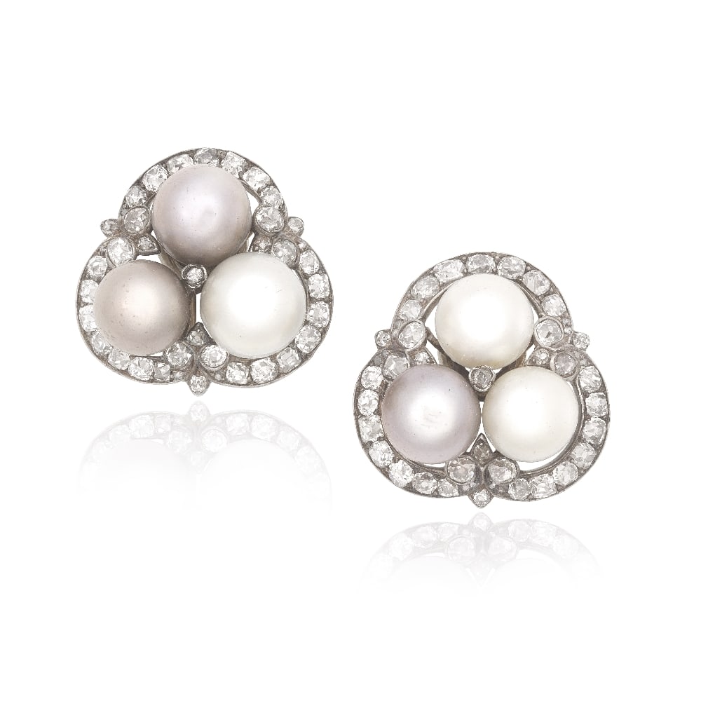 NATURAL PEARL AND DIAMOND EARCLIPS: NATURAL PEARL AND DIAMOND EARCLIPS Each set with three natural pearls of varying white and grey tints, measuring 9.36 - 9.52 x 7.42mm to 10.13 - 10.47 x 8.55mm, within trefoil surrounds set with old