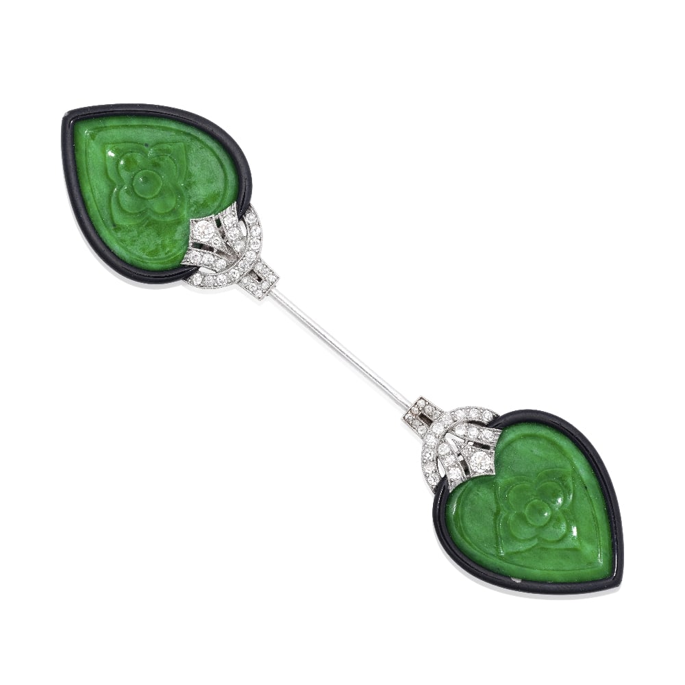 JADE, ENAMEL AND DIAMOND JABOT PIN, CIRCA 1925: JADE, ENAMEL AND DIAMOND JABOT PIN, CIRCA 1925 Each terminal with a foliate carved jade plaque to a black enamel surround, accented by old brilliant and single-cut diamonds, French assay marks,