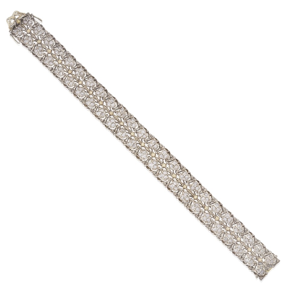 MARIO BUCCELLATI: DIAMOND BRACELET, CIRCA 1925: MARIO BUCCELLATI: DIAMOND BRACELET, CIRCA 1925 The articulating strap with pierced links of floral and foliate 'modellato' detail, issuing rose-cut diamond leaves, mounted in silver and gold, signed