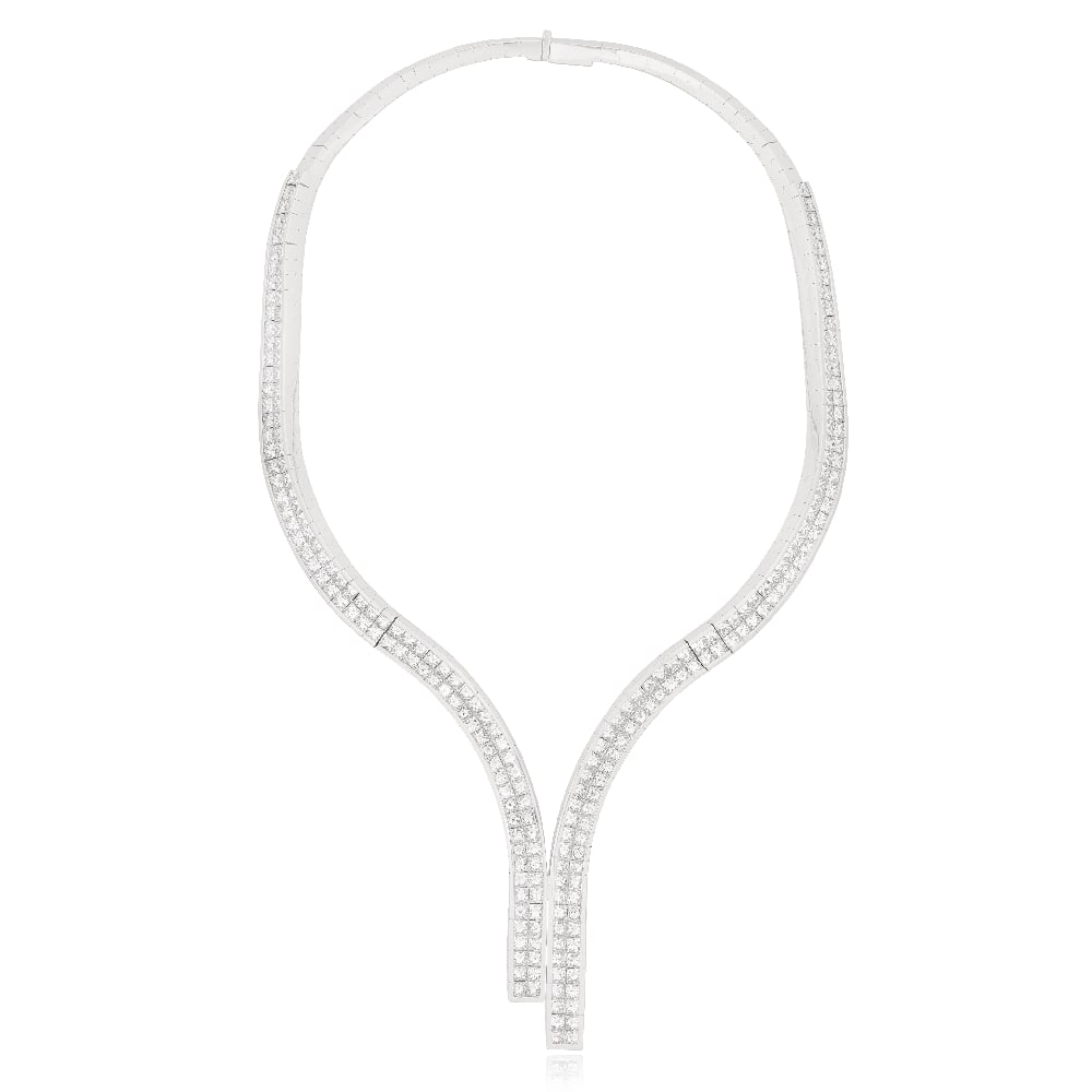 DIAMOND-SET NECKLACE: DIAMOND-SET NECKLACE The articulated asymmetrical necklace, channel-set to the front with rows of princess-cut diamonds, diamonds approximately 46.00 carats total, length approximately 39.0cm For