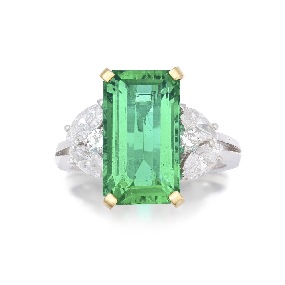 EMERALD AND DIAMOND RING: EMERALD AND DIAMOND RING The emerald weighing approximately 4.30 carats, between marquise and brilliant-cut diamond shoulders, to a bifurcated band, maker's mark for Jacques Gérardy, French assay