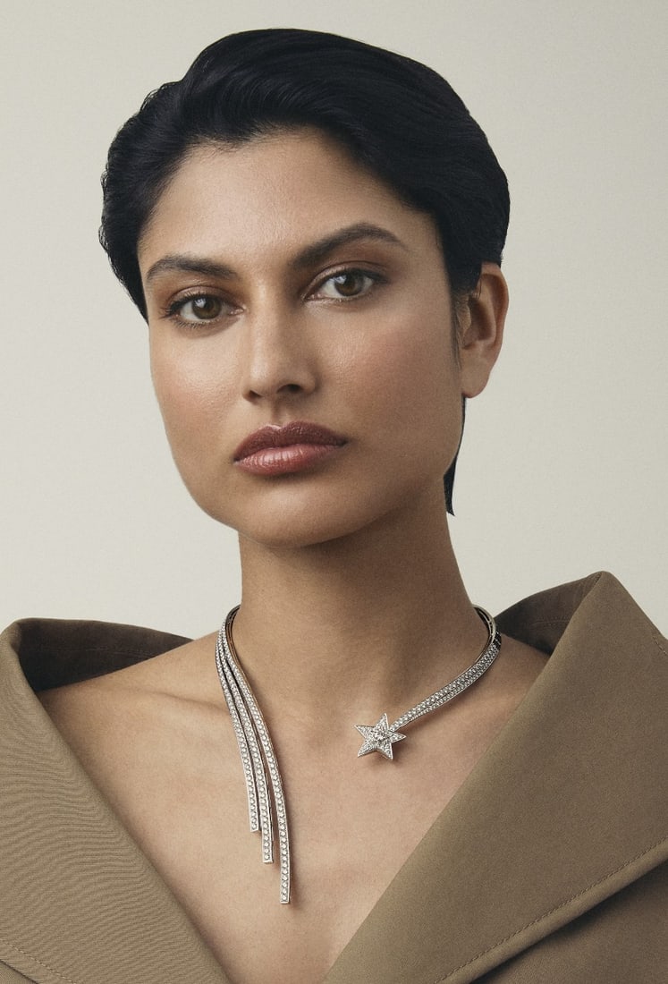 CHANEL: DIAMOND 'FIL DE COMÈTE' NECKLACE: CHANEL: DIAMOND 'FIL DE COMÈTE' NECKLACE Designed as a shooting comet, set throughout with brilliant-cut diamonds, the central brilliant-cut diamond in the star weighing 0.51 carat, the blazing