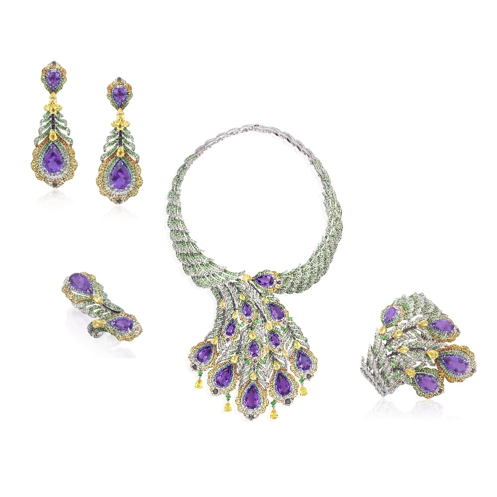 GEM-SET NECKLACE, BRACELET, EARRING AND RING SUITE (4): GEM-SET NECKLACE, BRACELET, EARRING AND RING SUITE Designed as a colourful plumage of peacock feathers, set throughout with circular-cut garnets and brilliant-cut diamonds, set to the front with