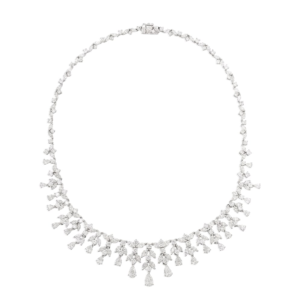 DIAMOND FRINGE NECKLACE: DIAMOND FRINGE NECKLACE The necklace designed as a graduating fringe of round brilliant and marquise-cut diamond foliate drops, each terminating with a pear-shaped diamond, diamond weight