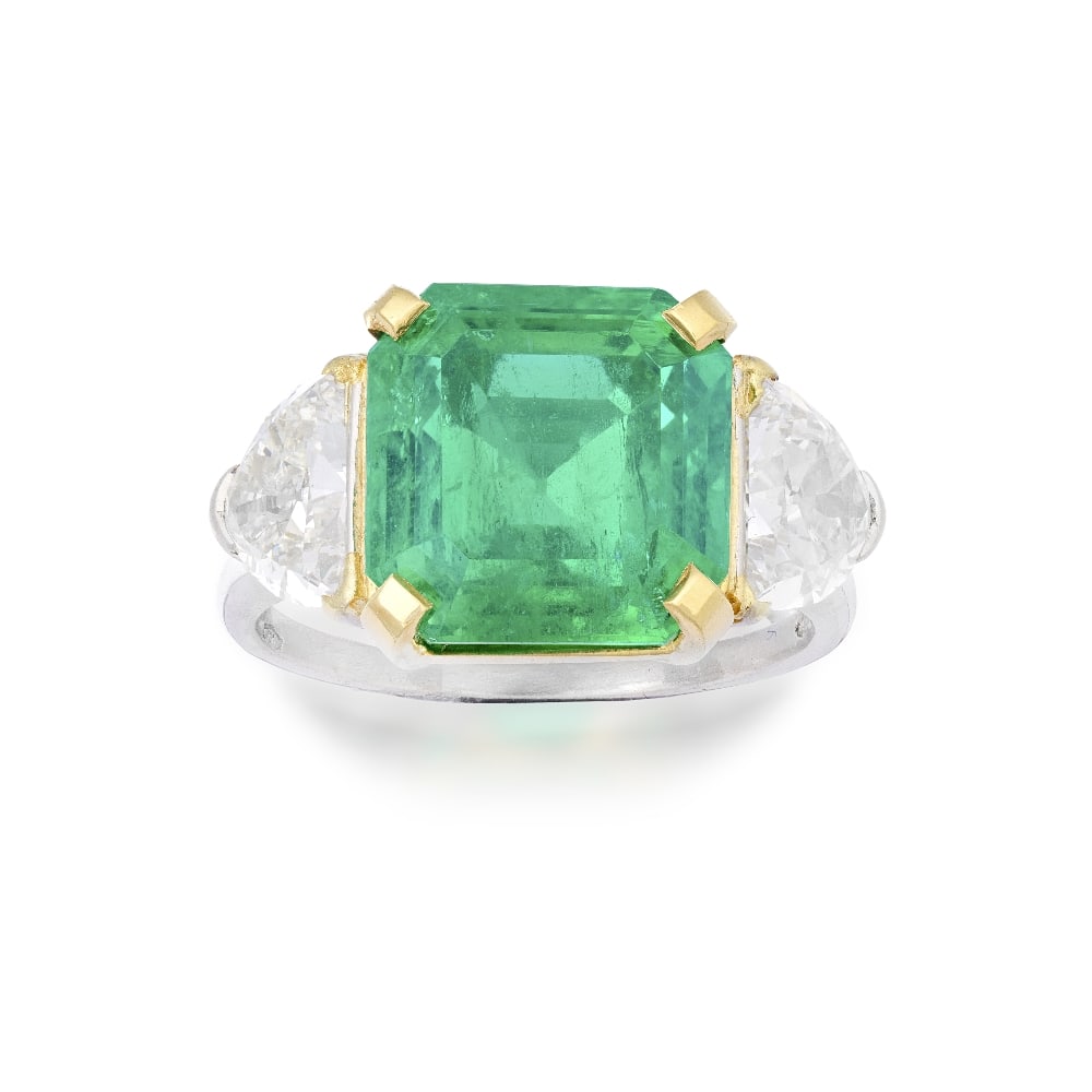BULGARI: EMERALD AND DIAMOND RING, CIRCA 1965: BULGARI: EMERALD AND DIAMOND RING, CIRCA 1965 The octagonal step-cut emerald weighing 5.21 carats, between demi-lune-cut diamond shoulders, signed Bulgari, maker's mark Sté BF, ring size J½