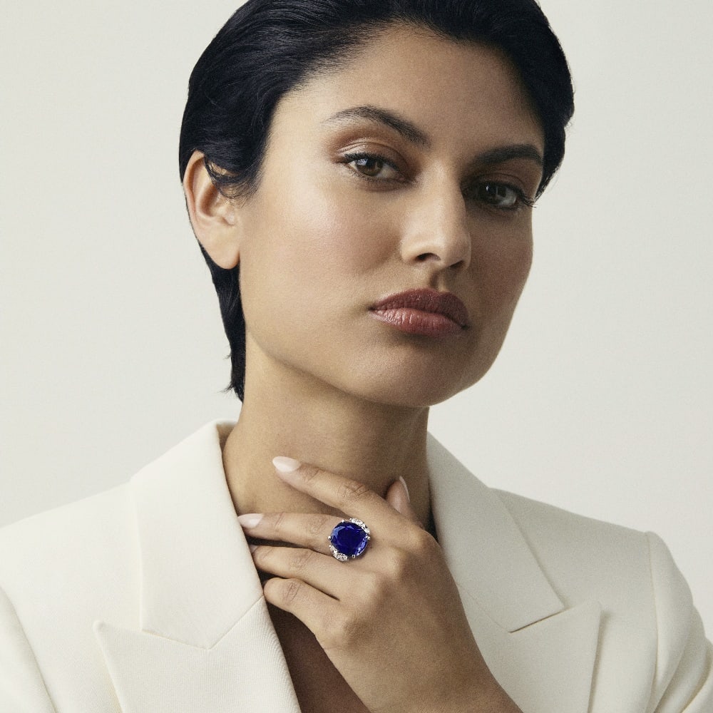 SAPPHIRE AND DIAMOND RING: SAPPHIRE AND DIAMOND RING The cushion-cut sapphire weighing 25.48 carats, between pear-cut diamond shoulders, ring size N Footnotes: Accompanied by a report from SSEF stating that the sapphire is of S