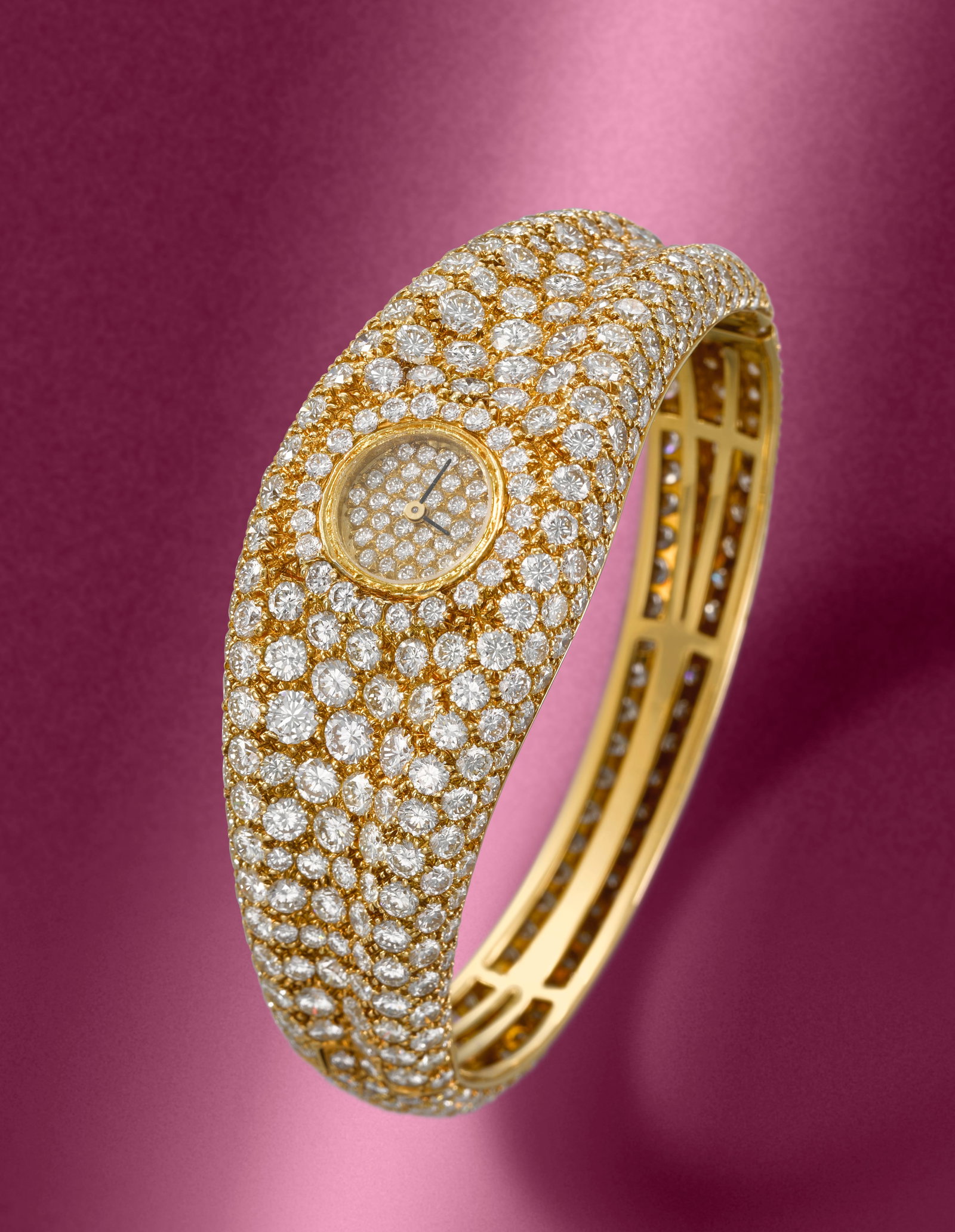 Graff. A fine lady's 18K gold diamond set quartz bracelet watch Circa 1990: Graff. A fine lady's 18K gold diamond set quartz bracelet watch Date: Circa 1990 Movement: Jewelled quartz Dial: Pavé-set brilliant-cut diamonds, black pointed baton hands Case: Polished round, s