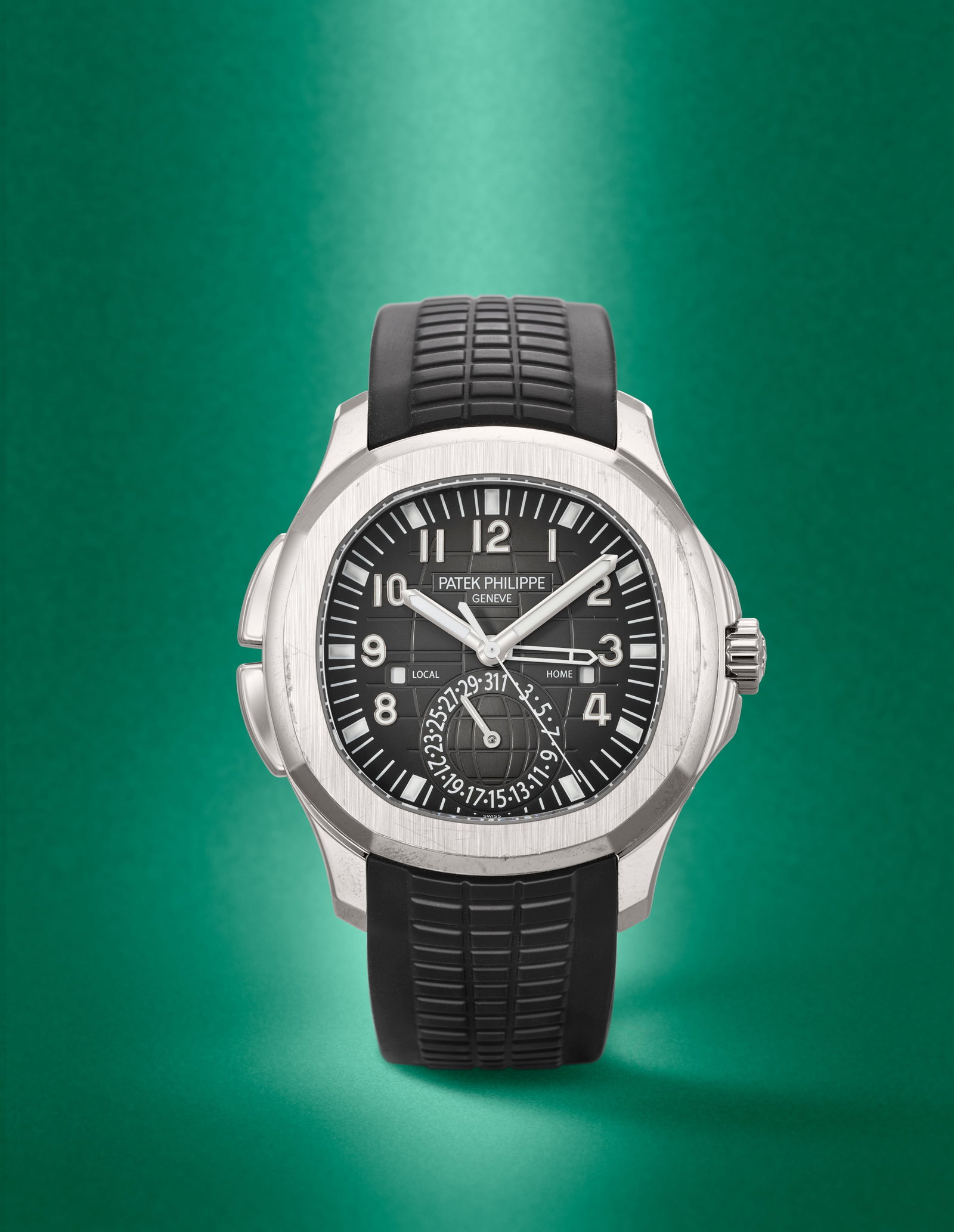 Patek Philippe. A fine stainless steel automatic calendar wristwatch with dual time zone and day...: Patek Philippe. A fine stainless steel automatic calendar wristwatch with dual time zone and day/night indication Model: Aquanaut Travel Time Reference: 5164A Date: Circa 2018 Movement: 29-jewel Cal.3