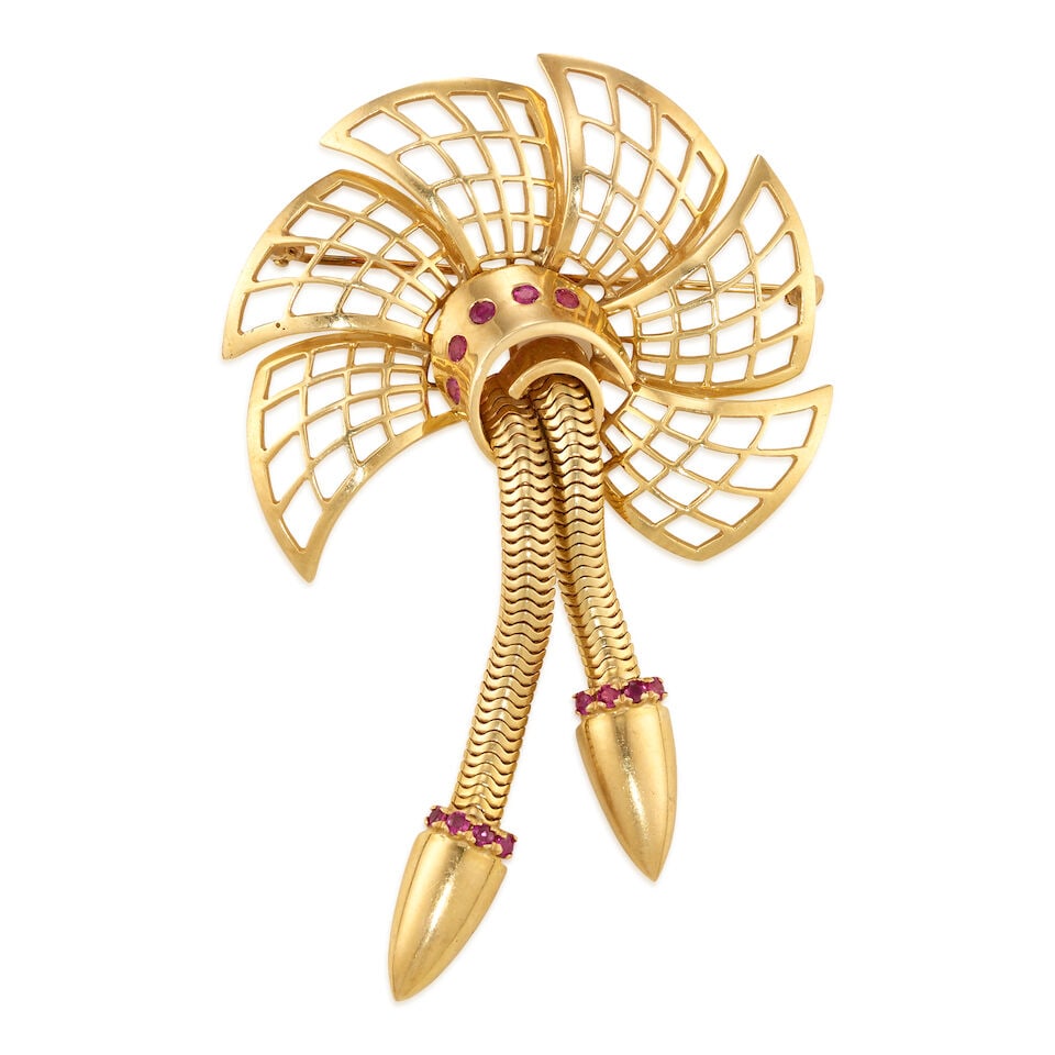 14K GOLD AND RUBY BROOCH: 14K GOLD AND RUBY BROOCH • 14K yellow gold • 13 round shaped rubies weighing approximately 0.40 carat total • Measures 3 13/16 in. x 2 1/2 in. • Estimated gross weight: 36.3