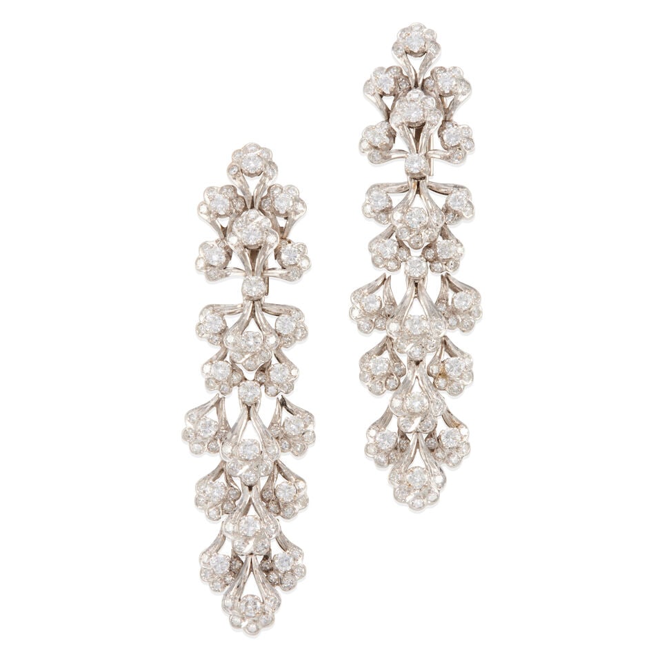 PAIR OF DIAMOND DROP EARRINGS: PAIR OF DIAMOND DROP EARRINGS • White precious metal alloy composed primarily of silver with palladium and minor gold content • Numerous round diamonds weighing approximately 3.70 - 3.80