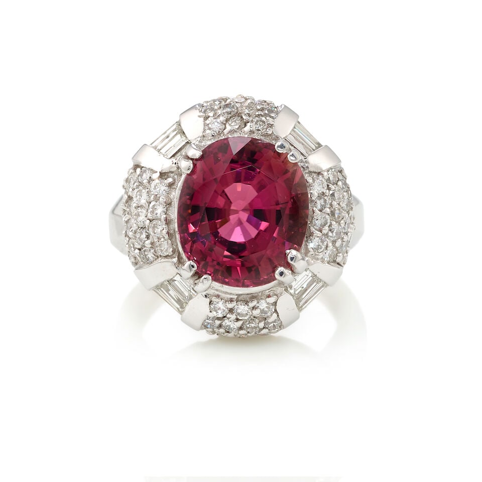 14K GOLD, TOURMALINE, AND DIAMOND RING: 14K GOLD, TOURMALINE, AND DIAMOND RING • 14K white gold • One oval shaped tourmaline weighing approximately 5 carats • Numerous round and rectangular shaped diamonds weighing approxi