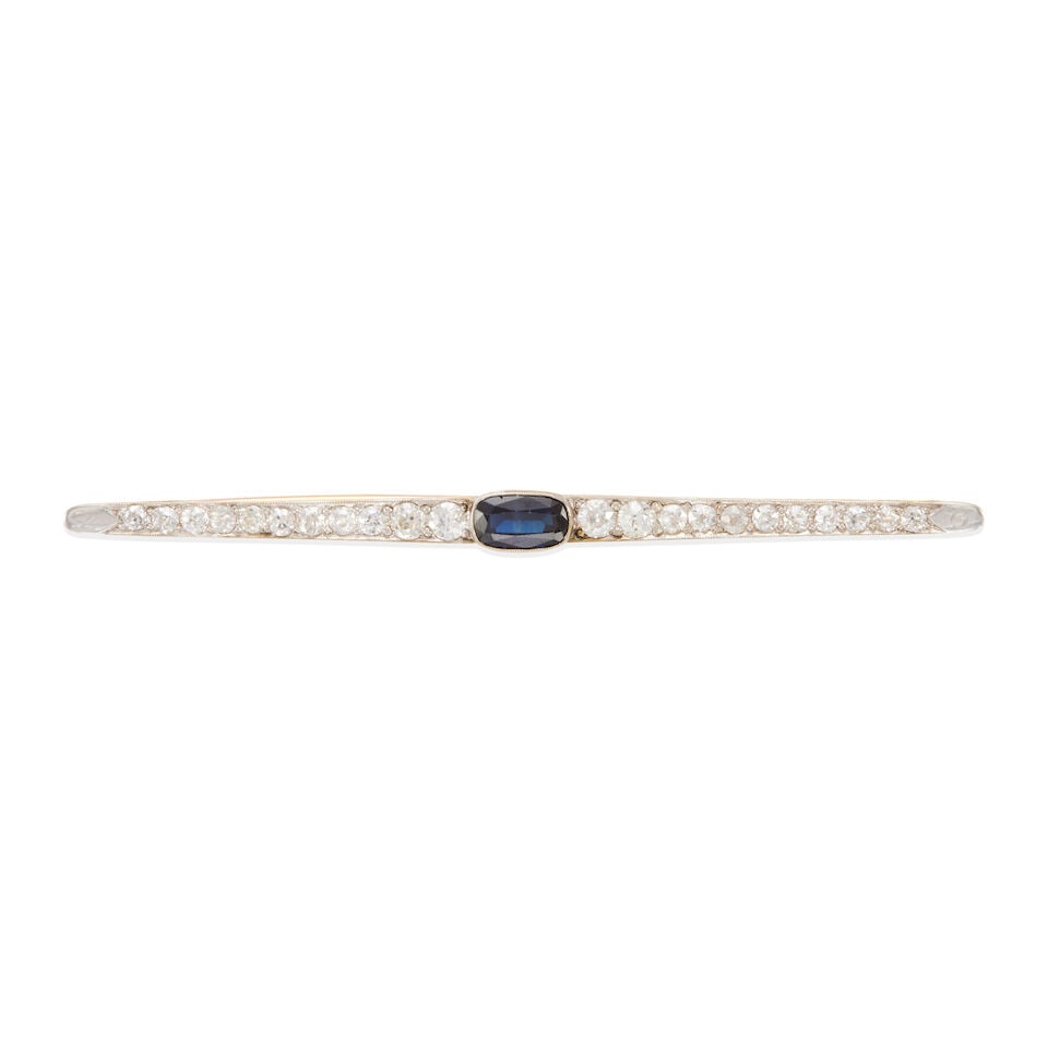 ANTIQUE SAPPHIRE & DIAMOND BROOCH: ANTIQUE SAPPHIRE & DIAMOND BROOCH • 14k yellow gold, base metal setting • Numerous old mine/European-cut diamonds weighing approximately 1.55 - 1.65 carat total • 1 oval sapphire