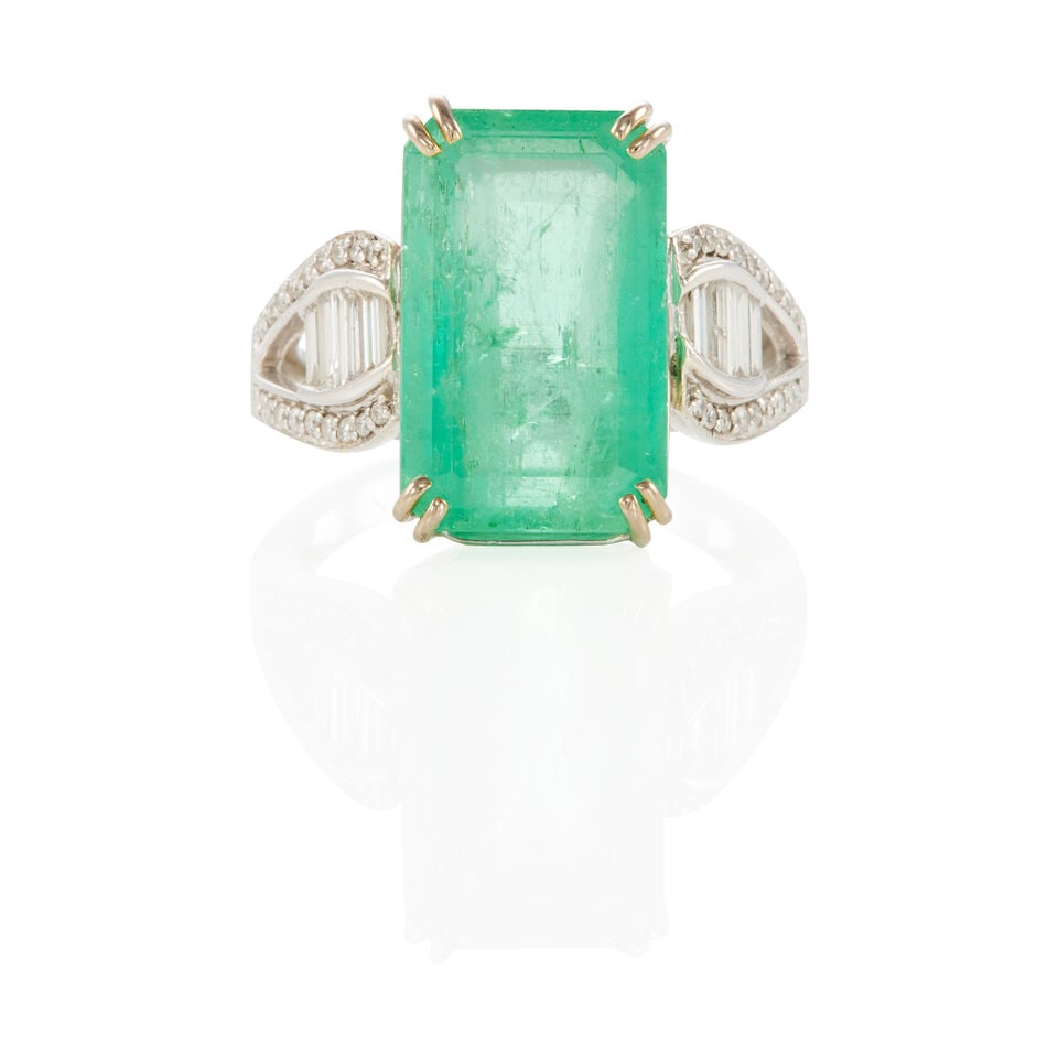 18K BICOLOR GOLD, DIAMOND AND EMERALD RING: 18K BICOLOR GOLD, DIAMOND AND EMERALD RING • 18k white and yellow gold • Numerous round and baguette diamonds weighing approximately 0.30 - 0.40 carat total • 1 rectangular emerald