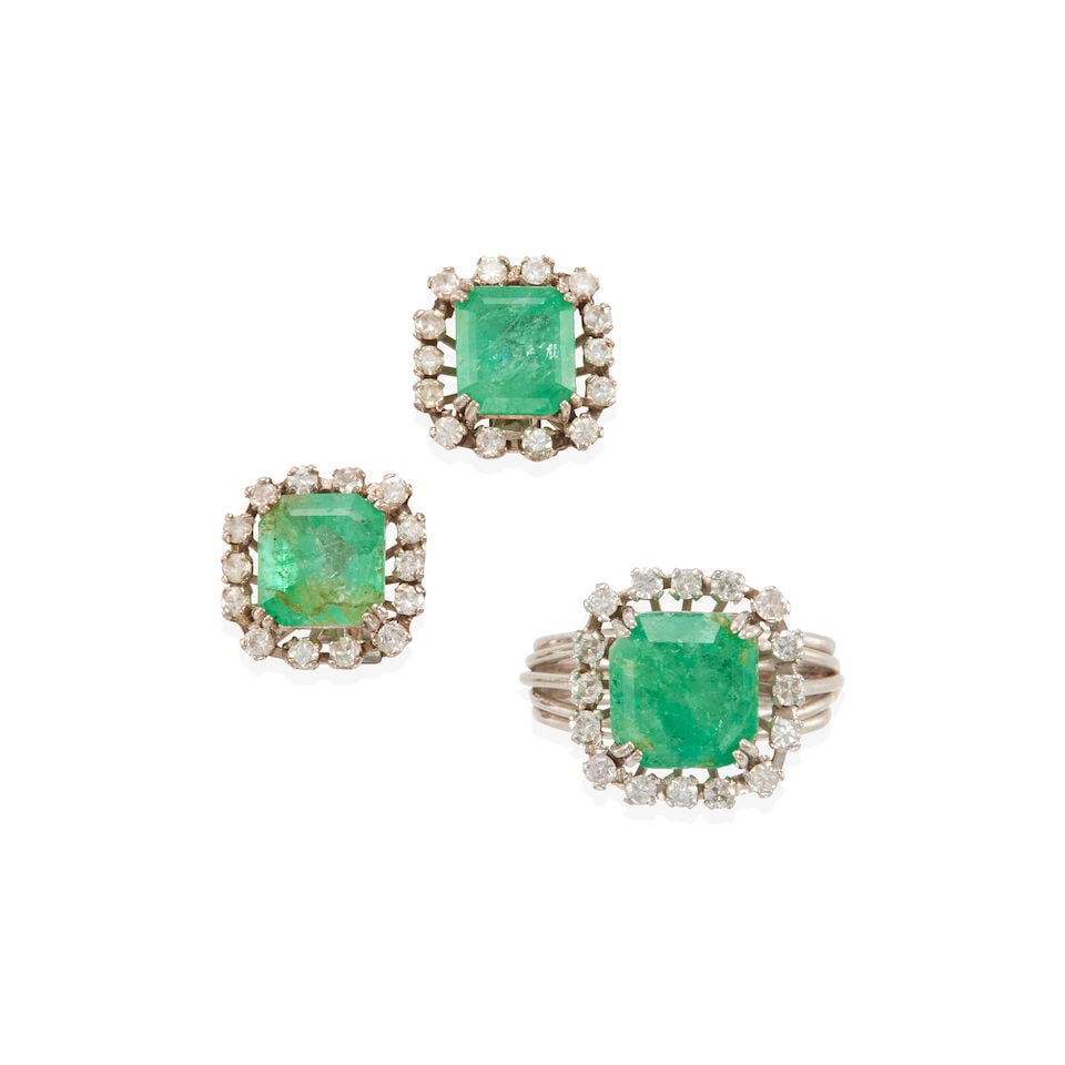 EMERALD AND DIAMOND SET: EMERALD AND DIAMOND SET • Pair of earrings with a white precious metal alloy composed primarily of silver with palladium and minor gold content, with numerous round diamonds weighing