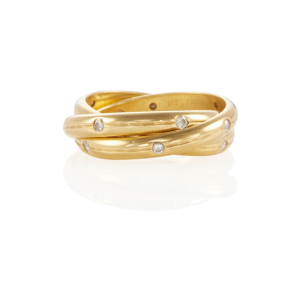 18K GOLD AND DIAMOND ROLLING RING: 18K GOLD AND DIAMOND ROLLING RING • 18k yellow gold • Numerous round diamonds weighing approximately 0.10 - 0.20 carat total • Size 4 3/4 • Estimated gross weight: 8.7 grams Fo