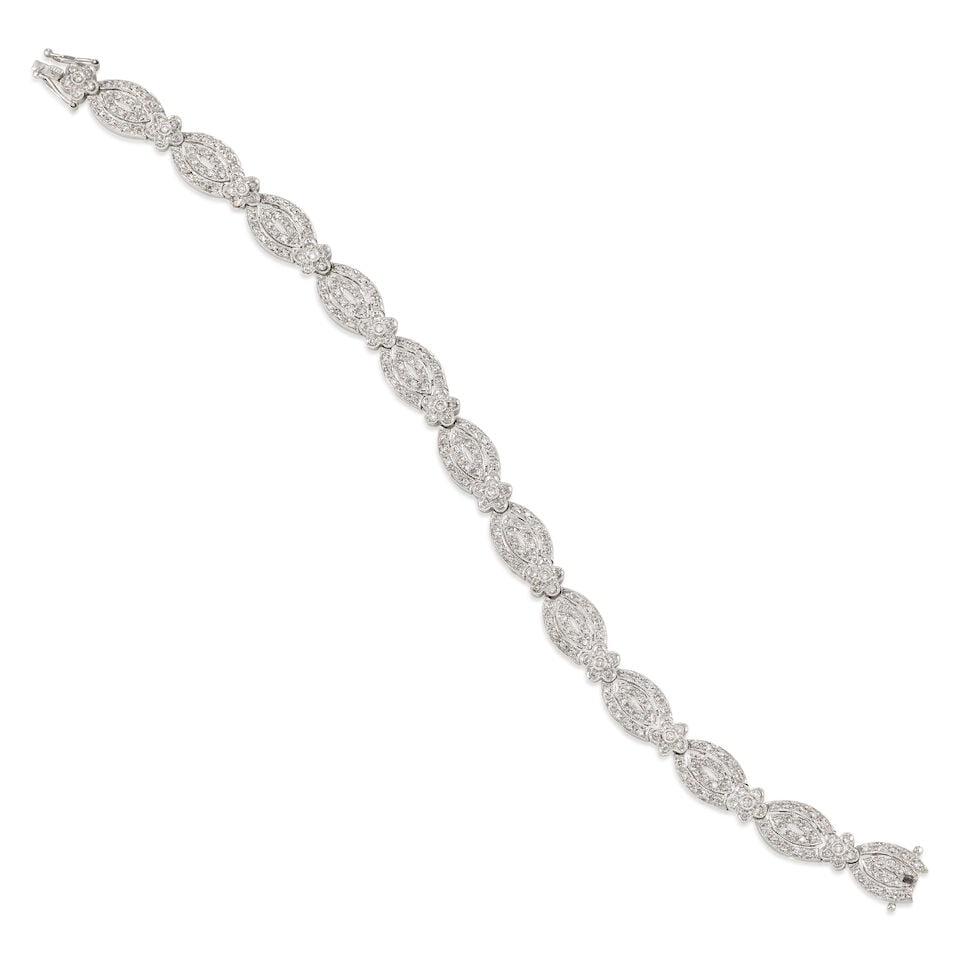 18K GOLD AND DIAMOND BRACELET: 18K GOLD AND DIAMOND BRACELET • 18K white gold • Numerous round shaped diamonds weighing approximately 2 carats total • Length 7 1/4 in. • Estimated gross weight: 19.7