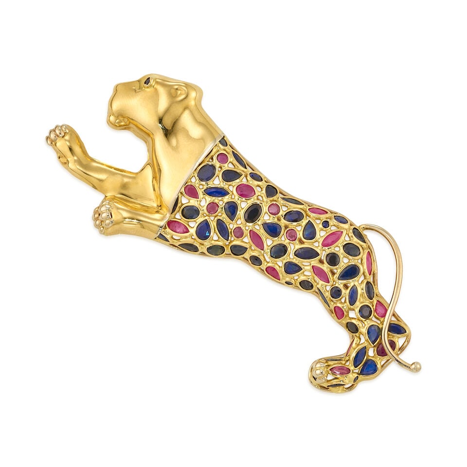 18K GOLD, SAPPHIRE, AND RUBY BROOCH: 18K GOLD, SAPPHIRE, AND RUBY BROOCH • 18K yellow gold • Numerous sapphires in various shapes and sizes, measuring approximately 1.48mm to 3.88mm in diameter • Numerous rubies in