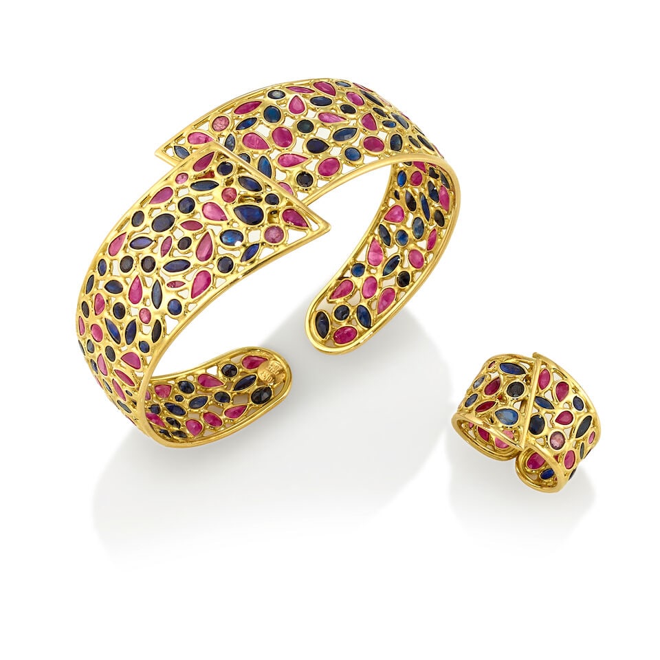 18K GOLD, RUBY, AND SAPPHIRE RING AND BANGLE: 18K GOLD, RUBY, AND SAPPHIRE RING AND BANGLE • One 18K yellow gold ring with rubies and sapphires in various shapes and sizes, measuring approximately 1.21mm to 4.45mm in diameter, size