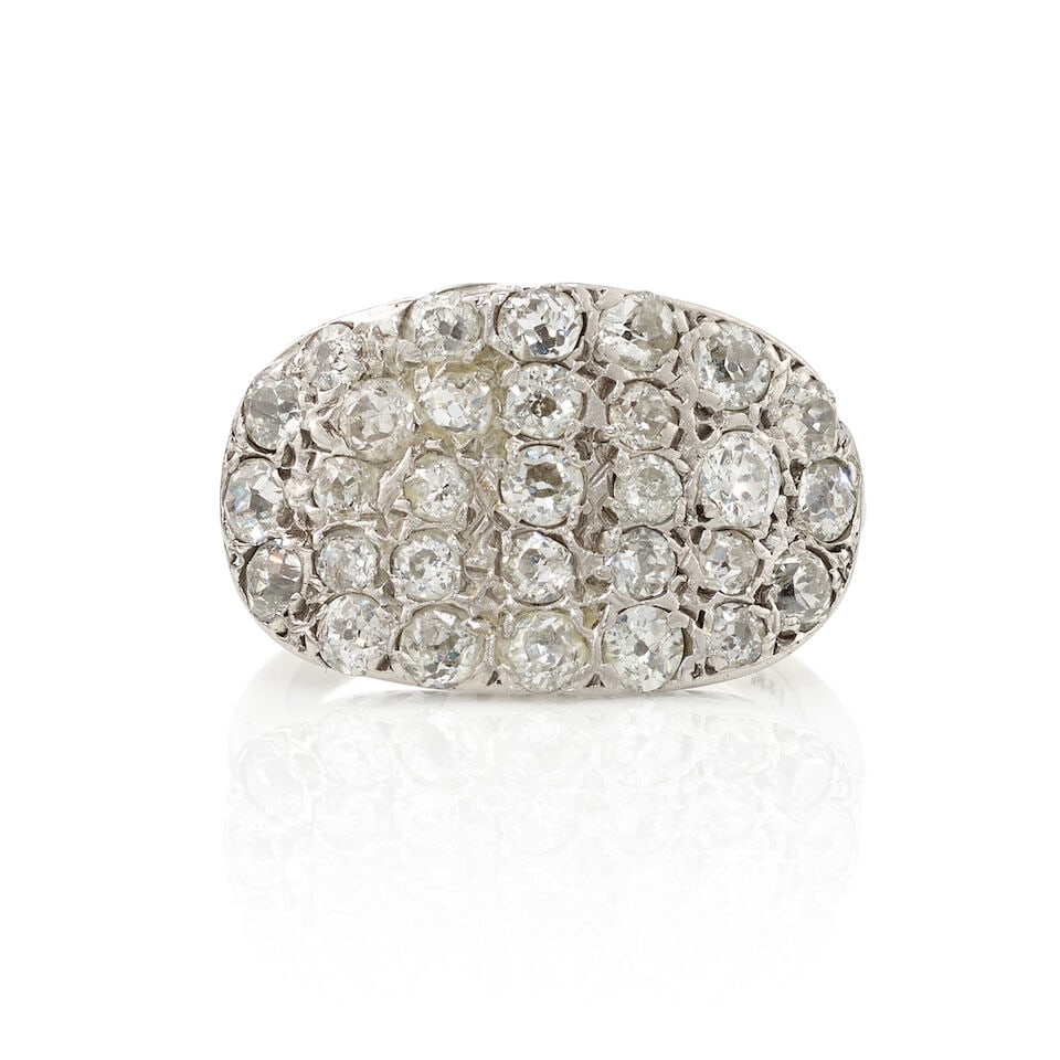 14K GOLD AND DIAMOND RING: 14K GOLD AND DIAMOND RING • 14K white gold • Numerous round shaped diamonds weighing approximately 1.20 carats total • Size 5 • Estimated gross weight: 4.2