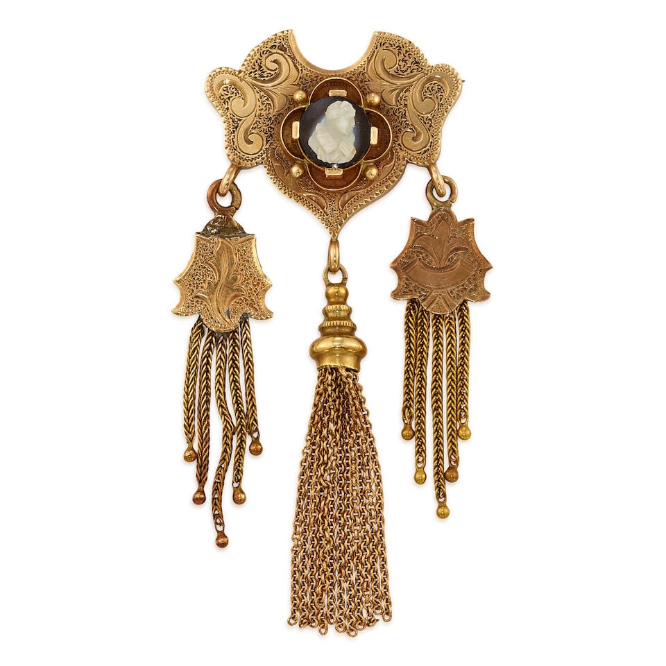 ANTIQUE GOLD AND CAMEO BROOCH: ANTIQUE GOLD AND CAMEO BROOCH • 12K and 14K yellow gold • One oval shaped onyx with a cameo measuring approximately 8.62mm in diameter • Measures 2 3/4 in. x 1 1/4 in. •