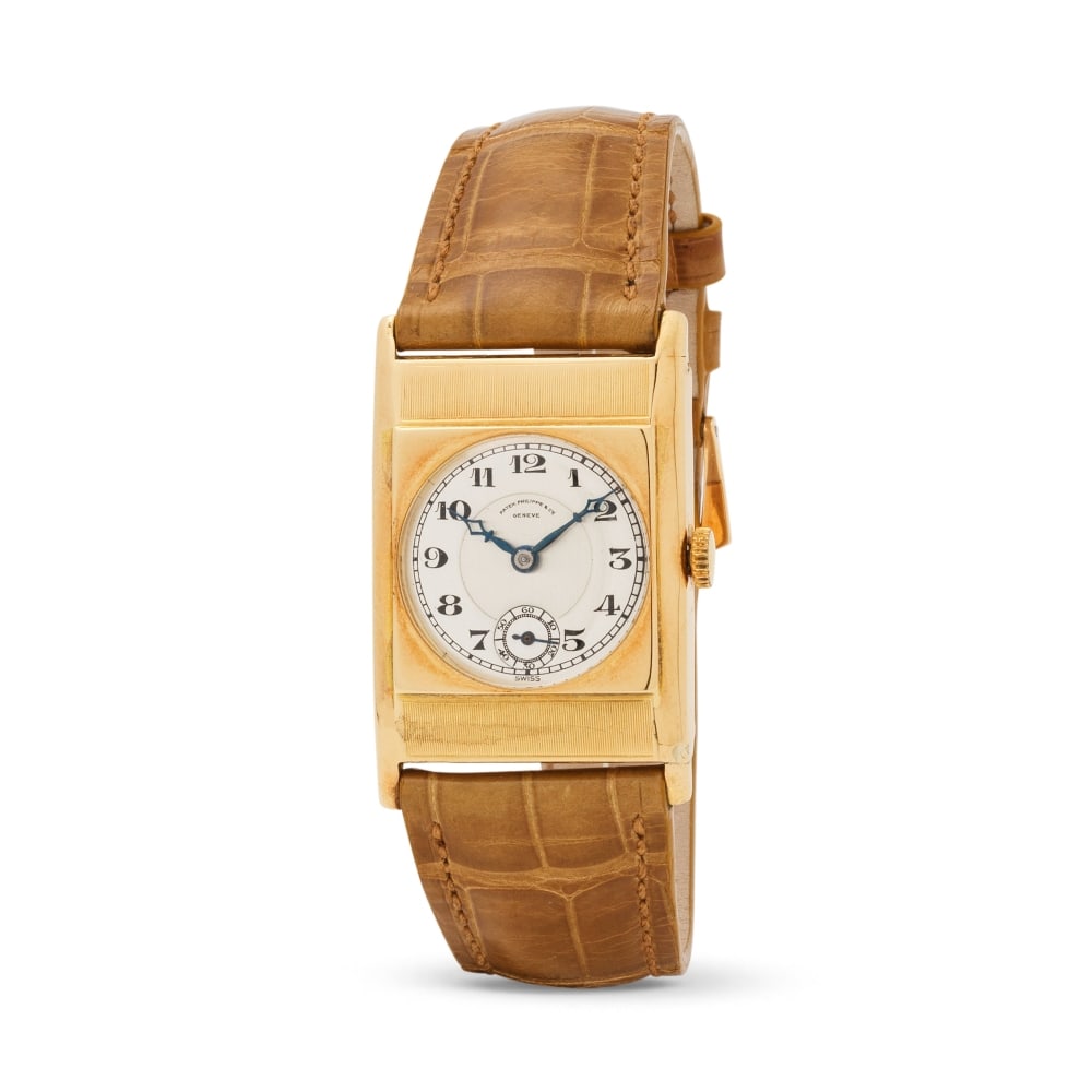 Patek Philippe. An 18K gold manual wind rectangular wristwatch Patek Philippe. Montre bracelet r... (1 of 1)