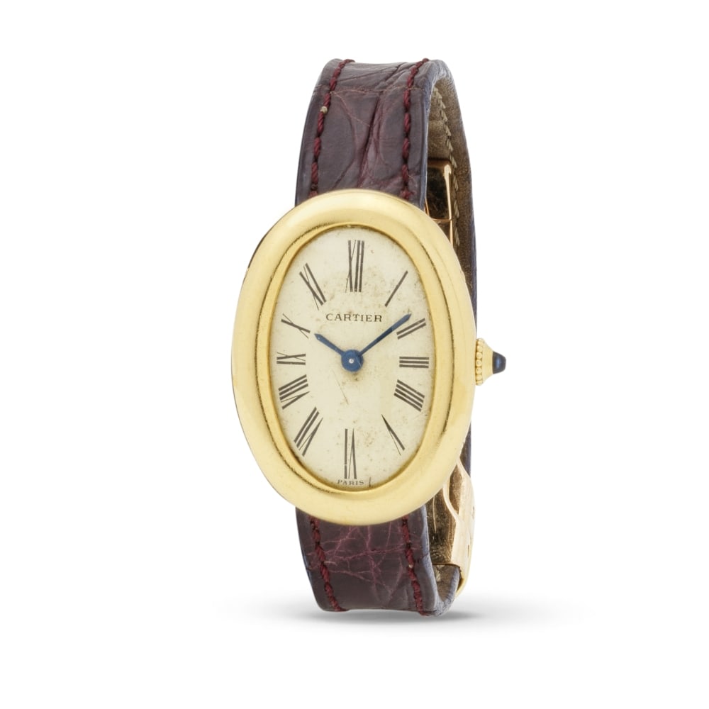 Cartier. A lady's 18K gold oval form manual wind wristwatch Cartier. Montre bracelet de dame en ... (1 of 1)