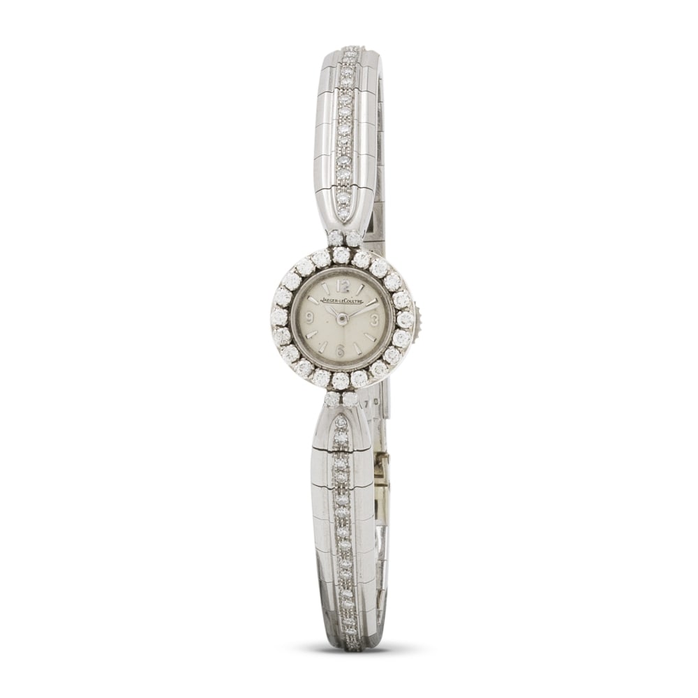 Jaeger-LeCoultre. A very elegant and fine lady's 18K white gold and diamond set manual wind cock...: Jaeger-LeCoultre. A very elegant and fine lady's 18K white gold and diamond set manual wind cocktail watch Jaeger-LeCoultre. Belle montre de cocktail en or blanc 18K (750) sertie de diamants mouvement
