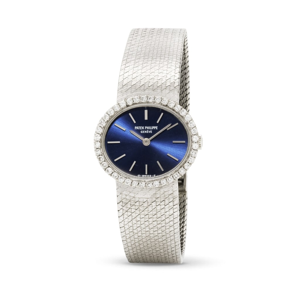 Patek Philippe. A fine lady's 18K white gold manual wind bracelet watch with diamond set bezel a... (1 of 1)