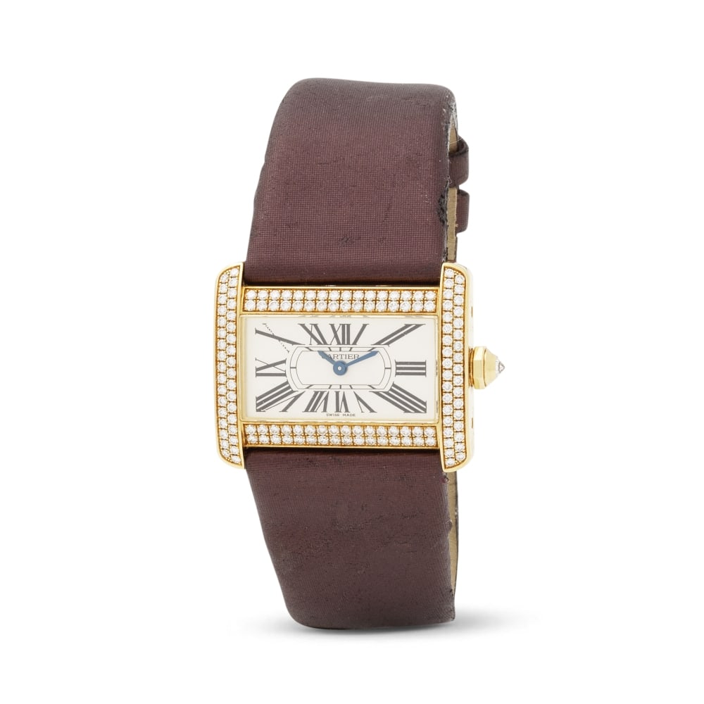 Cartier. A fine lady's 18K gold quartz wristwatch with diamond set bezel Cartier. Belle montre b... (1 of 1)