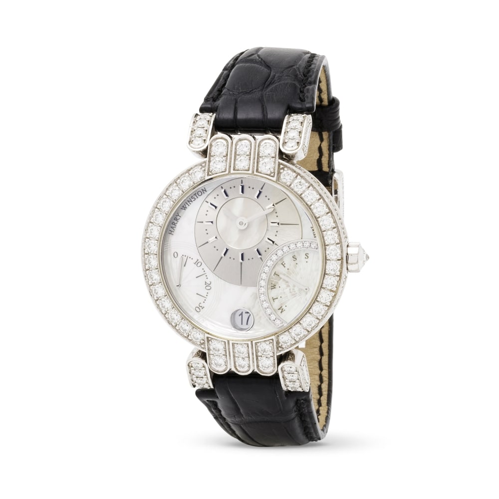 Harry Winston. An 18K white gold automatic calendar wristwatch with diamond set bezel and lugs a... (1 of 1)