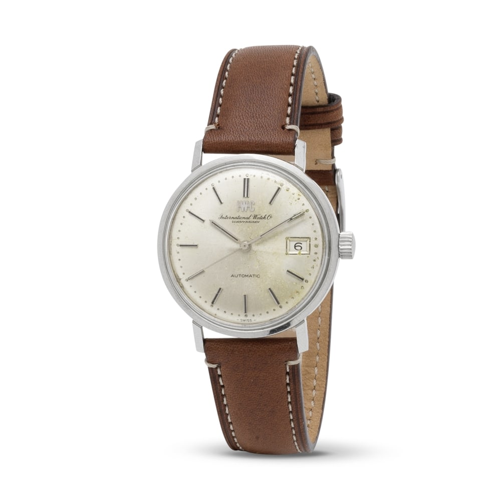 IWC. A stainless steel automatic calendar wristwatch bearing the signature of late King of Afgha...: IWC. A stainless steel automatic calendar wristwatch bearing the signature of late King of Afghanistan Zahir Shah IWC. Montre bracelet en acier avec date mouvement automatique avec gravure de la signa