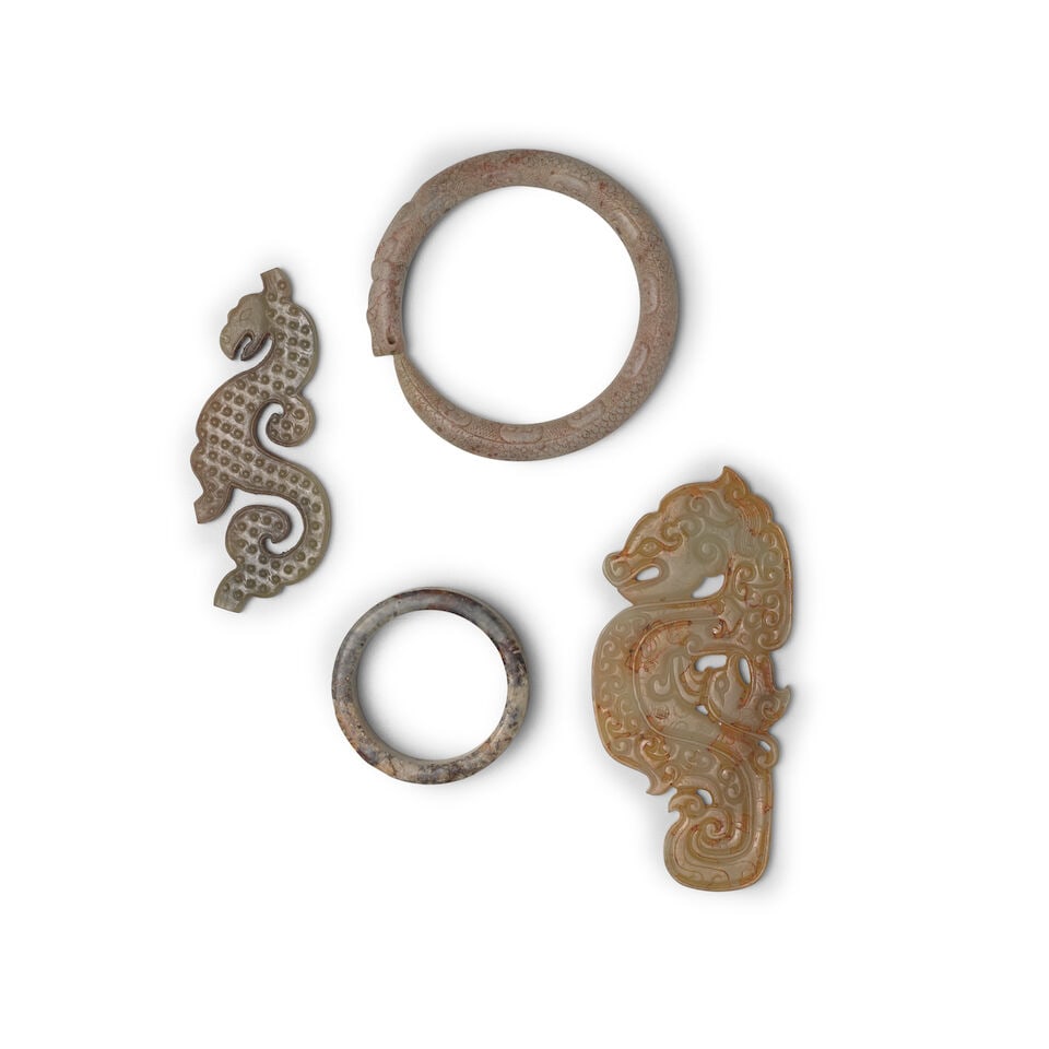 FOUR ARCHAIC-STYLE JADE AND HARDSTONE ORNAMENTS Warring States style, 20th century (4) - 2