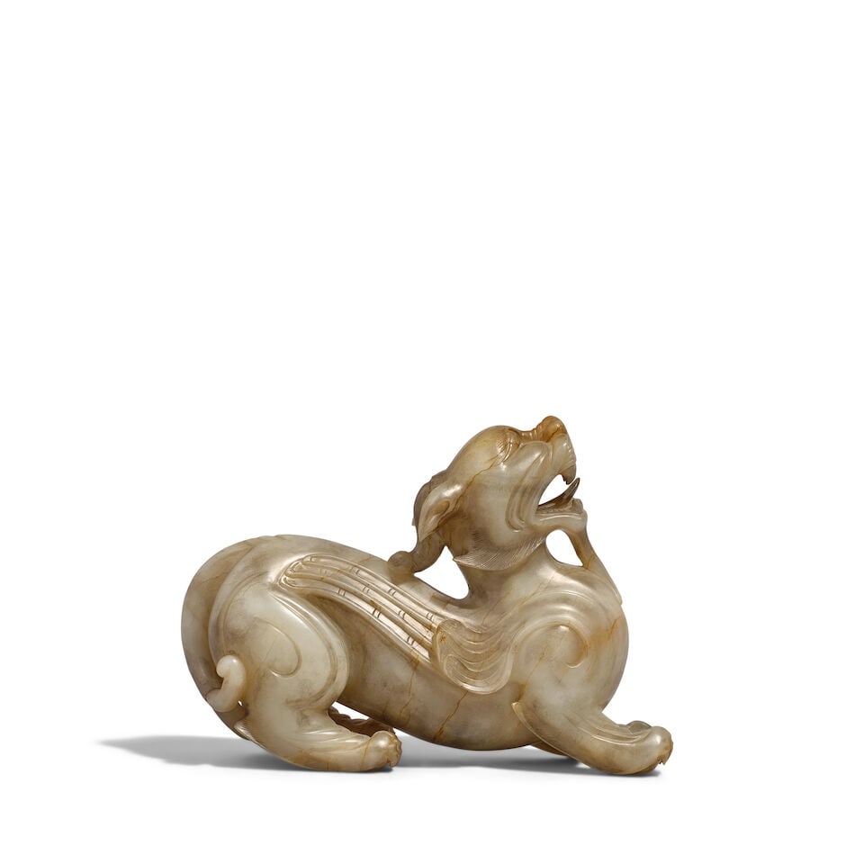 AN ARCHAIC-STYLE GRAY-CELADON JADE CARVING OF A RECUMBENT BEAST, BIXIE 20th century (1 of 1)