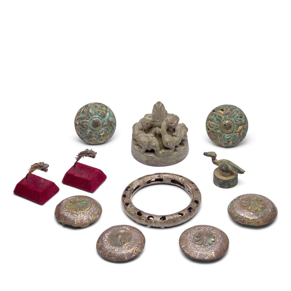 ELEVEN BRONZE AND GILT BRONZE FITTINGS AND WARES Warring States to Ming dynasty (11): ELEVEN BRONZE AND GILT BRONZE FITTINGS AND WARES Warring States to Ming dynasty The tallest 3in (7.6cm) high (11). Footnotes: 戰國至明 青銅及鎏金&