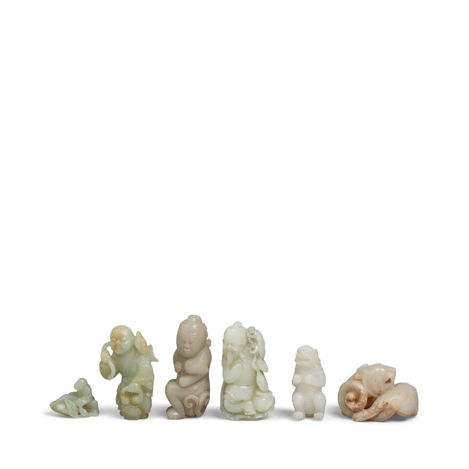 SIX JADE CARVINGS OF ANIMALS AND FIGURES 20th century (6): SIX JADE CARVINGS OF ANIMALS AND FIGURES 20th century Comprising: a figure on a large peach; an archaic-style coiled dragon; a sage on a lotus leaf; a boy holding a basket and lotus; a standing figure