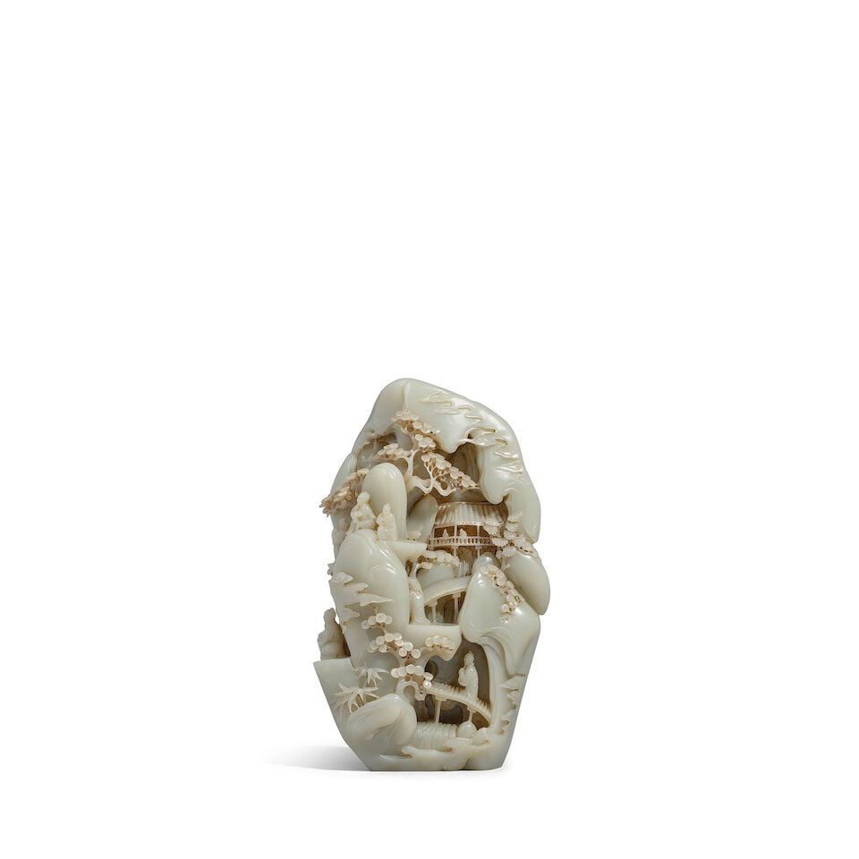 A PALE CELADON JADE 'MOUNTAIN RETREAT' BOULDER 20th century (fitted wood stand): A PALE CELADON JADE 'MOUNTAIN RETREAT' BOULDER 20th century 10 1/4in (26cm) high (fitted wood stand). Footnotes: 二十世紀 青白玉松澗閑ऺ
