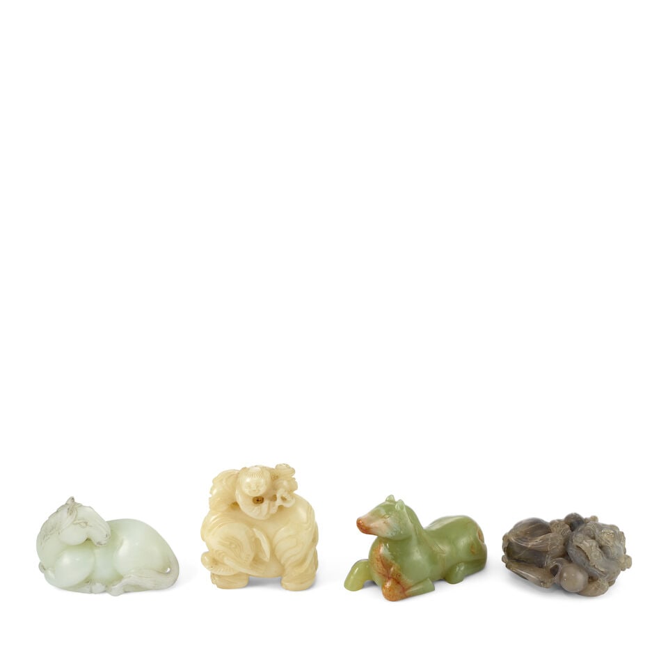 FOUR JADE AND HARDSTONE CARVINGS OF ANIMALS 20th century (4): FOUR JADE AND HARDSTONE CARVINGS OF ANIMALS 20th century Comprising: a recumbent horse; a recumbent horse with its head turned back; a boy resting on the shoulders of an elephant; and a lion cub playi