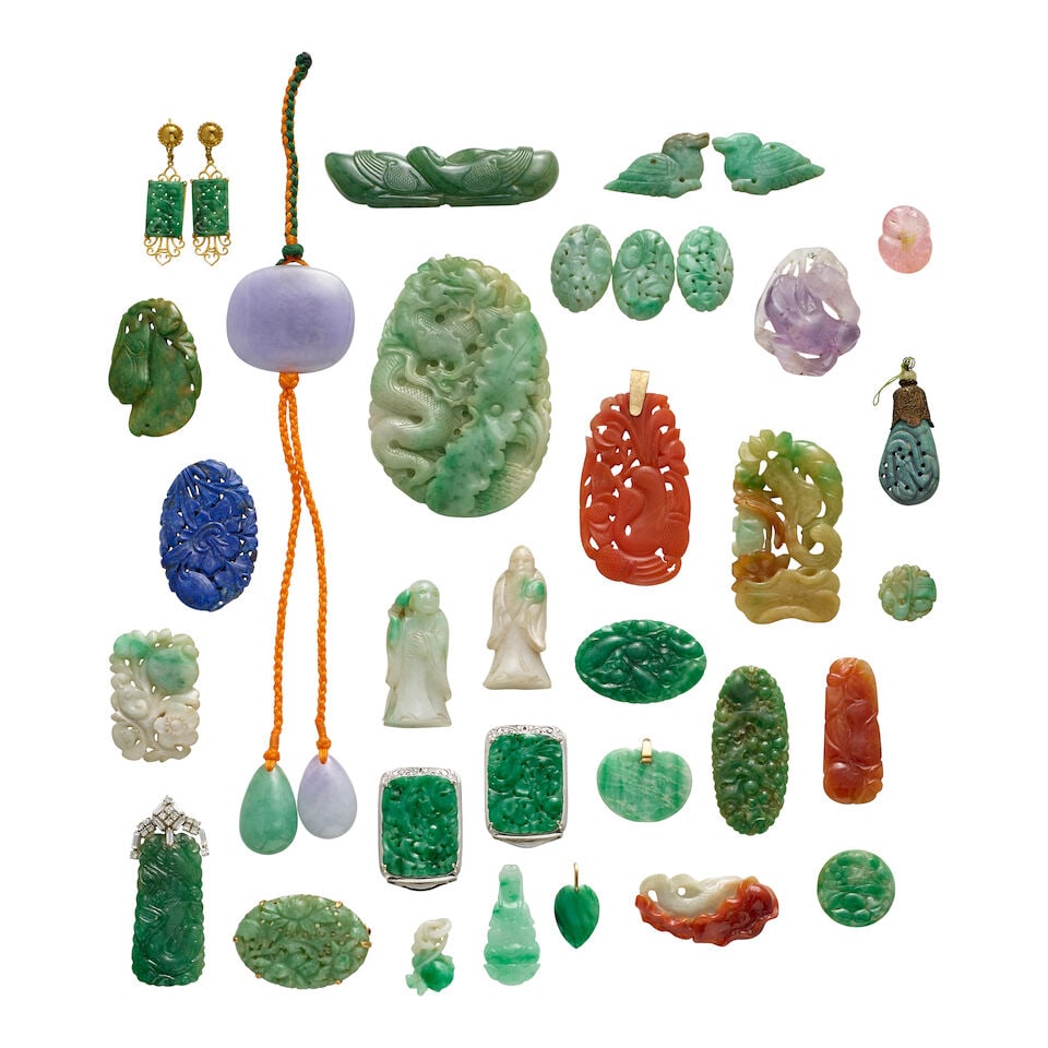 A GROUP OF JADE, GEMSTONE, RESIN AND GOLD PENDANTS AND ORNAMENTS 20th century: A GROUP OF JADE, GEMSTONE, RESIN AND GOLD PENDANTS AND ORNAMENTS 20th century Comprising: 14k and 18k gold, jade, quartz, diamond, nephrite, resin, and lapis lazuli pendants and jewelry. 3 1/4in (8.3c