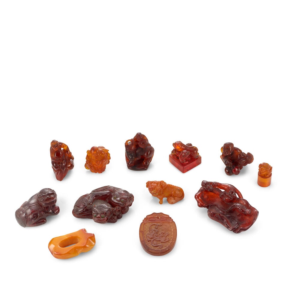 TWELVE MINIATURE AMBER AND RESIN CARVINGS 20th century (12) (1 of 1)