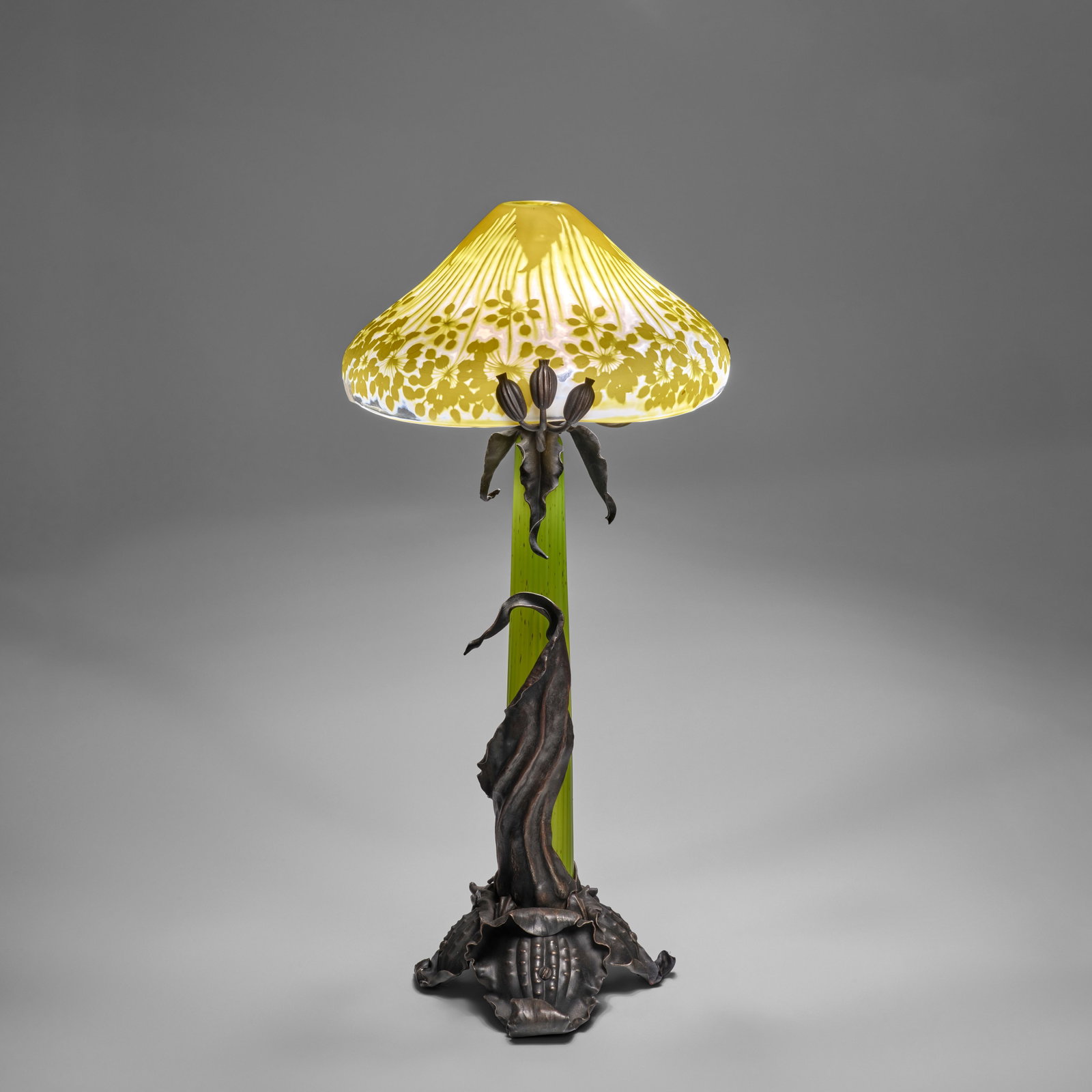 ÉMILE GALLÉ (1846-1904) 'Ombelle' Table Lampcirca 1903overlaid, acid-etched and wheel-...: ÉMILE GALLÉ (1846-1904) 'Ombelle' Table Lamp circa 1903 overlaid, acid-etched and wheel-polished glass, patinated wrought iron, cameo mark 'GALLÉ' height 30in (76cm); diameter of shade 