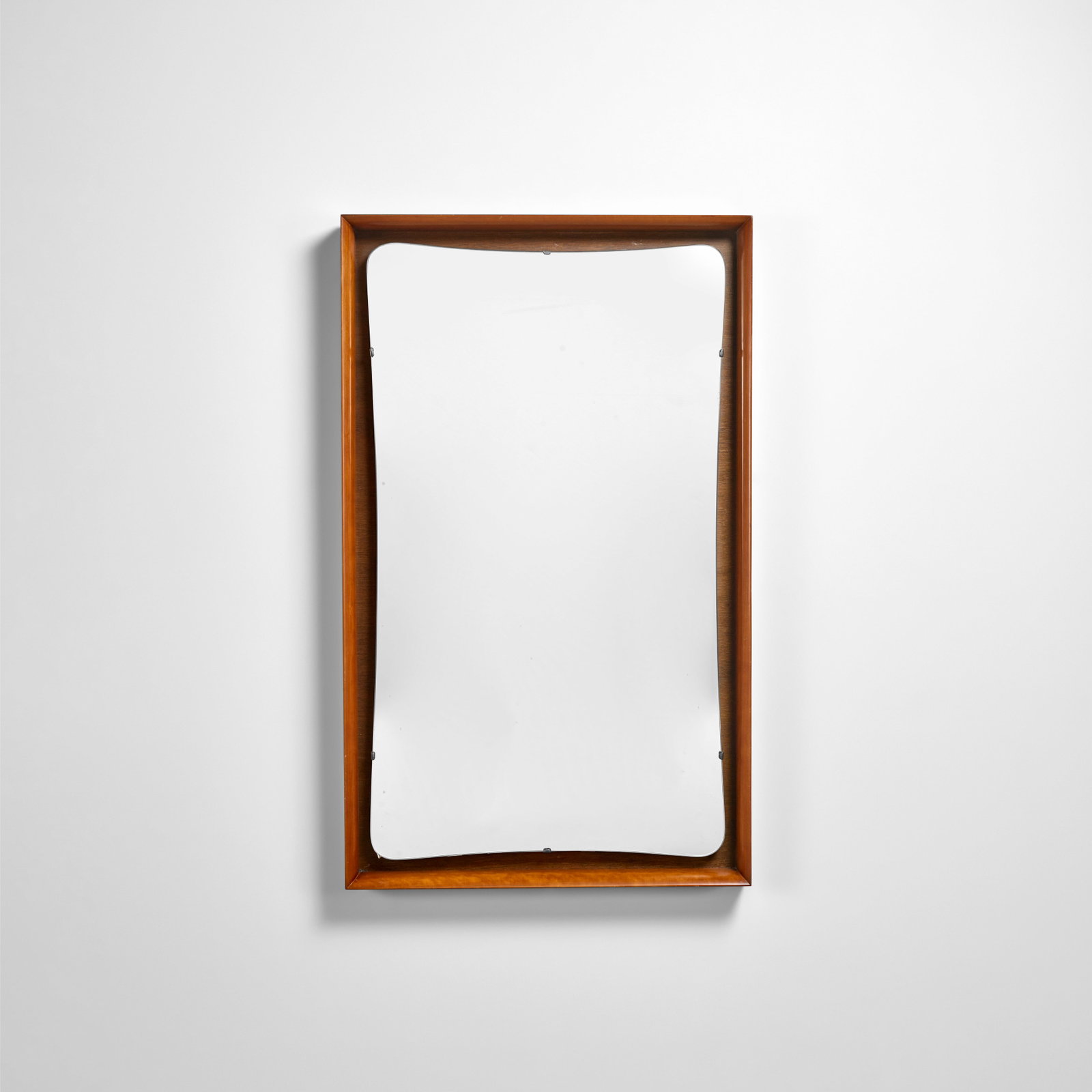 VLADIMIR KAGAN (1927-2016) Wall Mirrorcirca 1955cherrywood and mirror plateheight 46in (107cm); ... (1 of 1)
